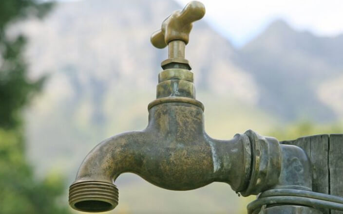 A tap that once was attached to a blocked drain, that is now clear.